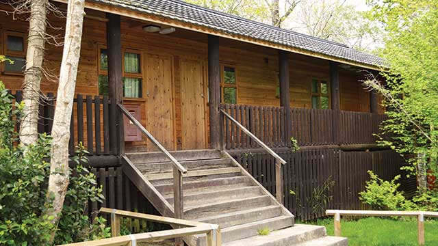 Wooden cabin style accommodation at PGL